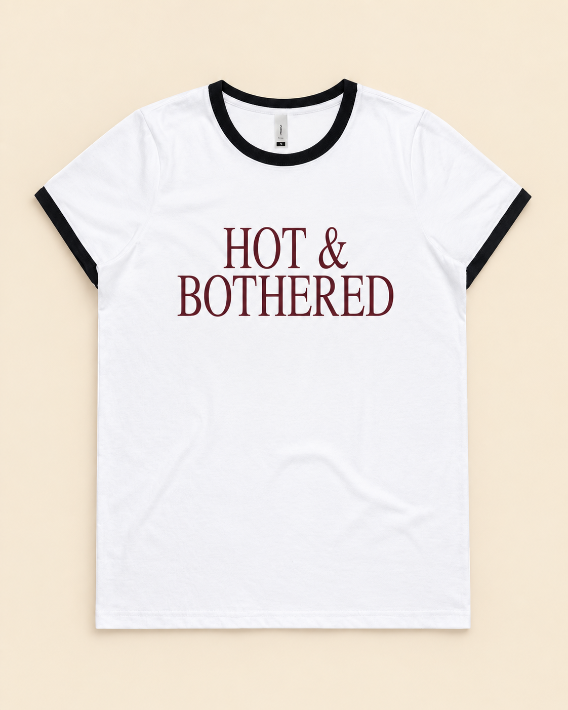 Hot & Bothered white and black Maple Ringer Tee on a cream background