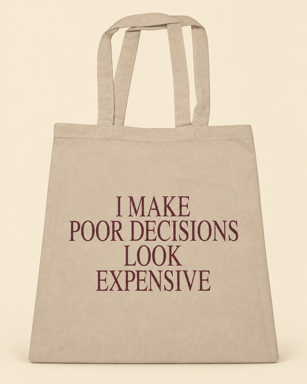 I Make Poor Decisions Look Expensive canvas tote on a cream background